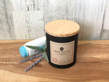 Load image into Gallery viewer, Innocence Soy Wax Candle | 13oz Matte Black Glass Jar with Wooden Lid